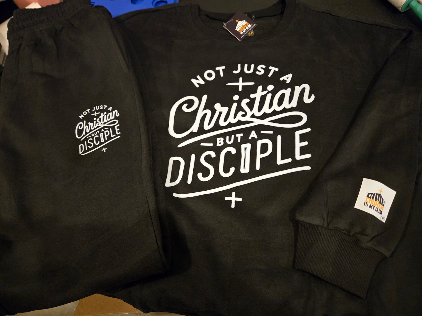 Black sweatshirt jogger set with 'Not Just a Christian But a Disciple' statement